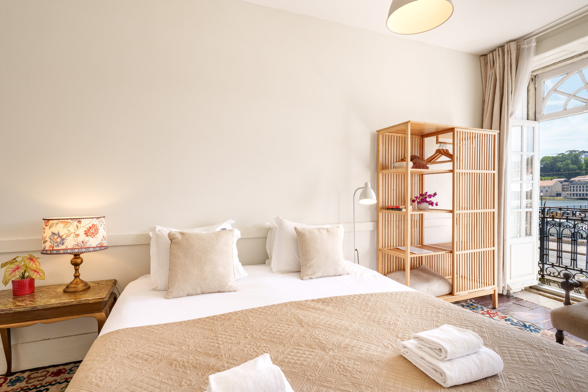 Bright bedroom with balcony and wardrobe