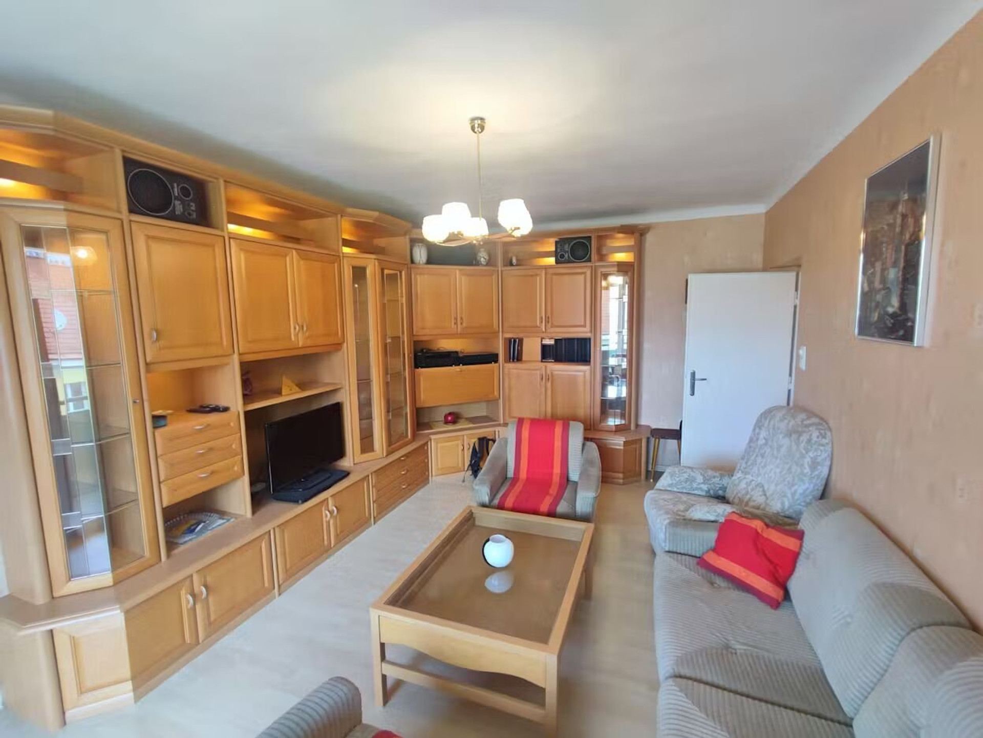 Living room with wooden wall unit
