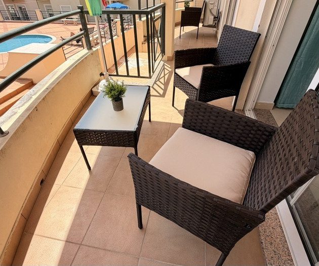Balcony seating with pool view