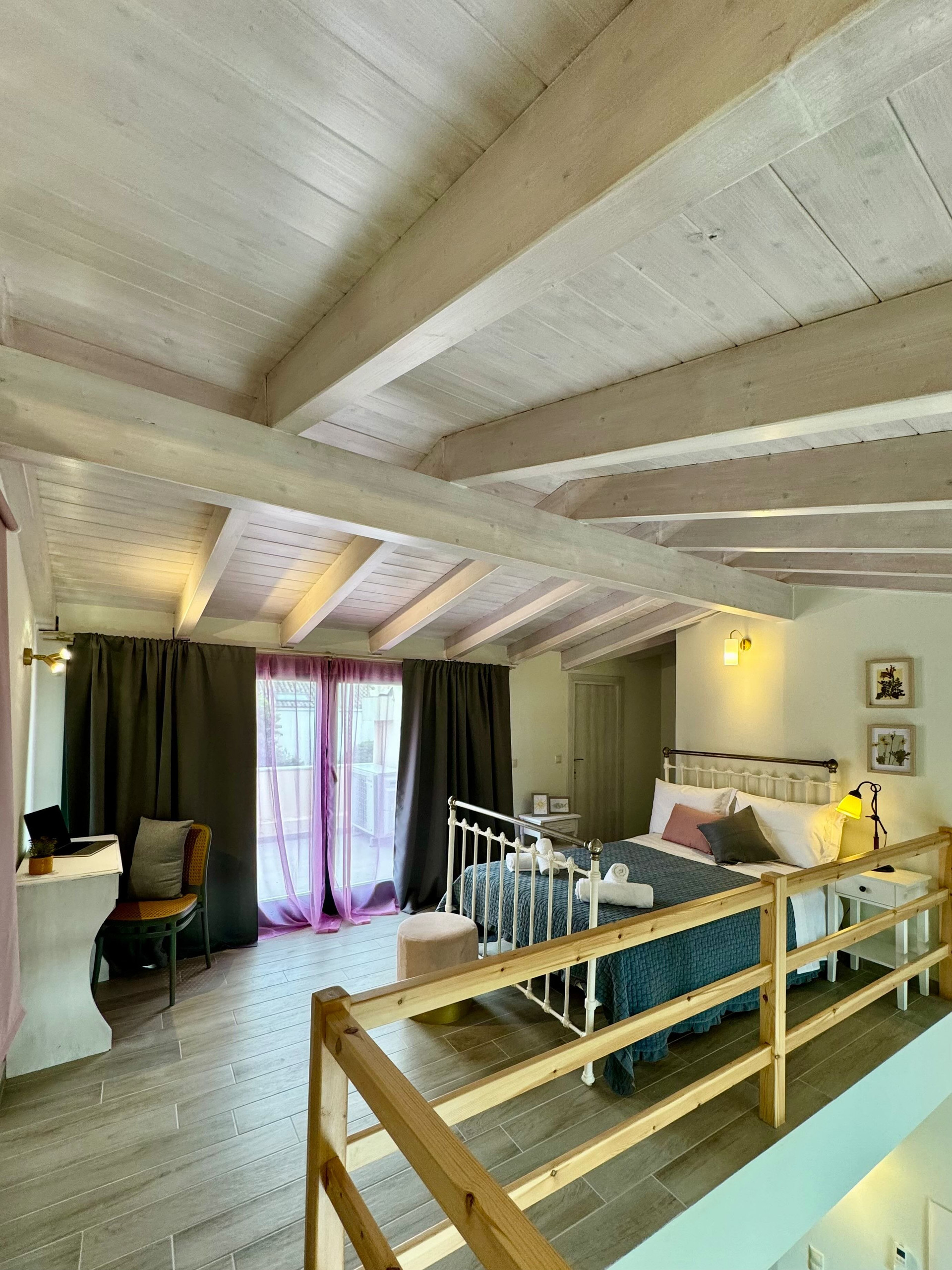 Loft bedroom with balcony access