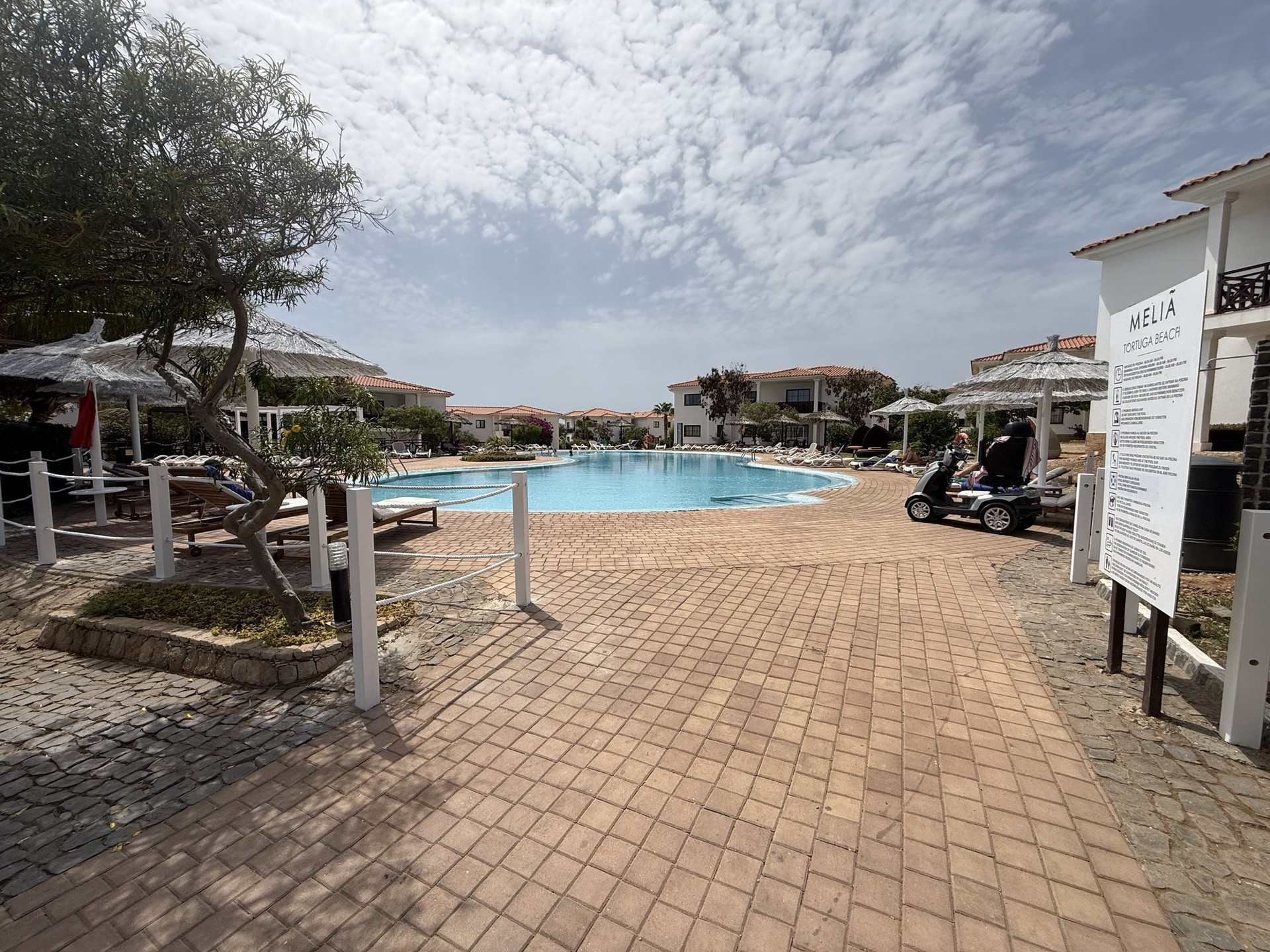 Resort pool with sun loungers