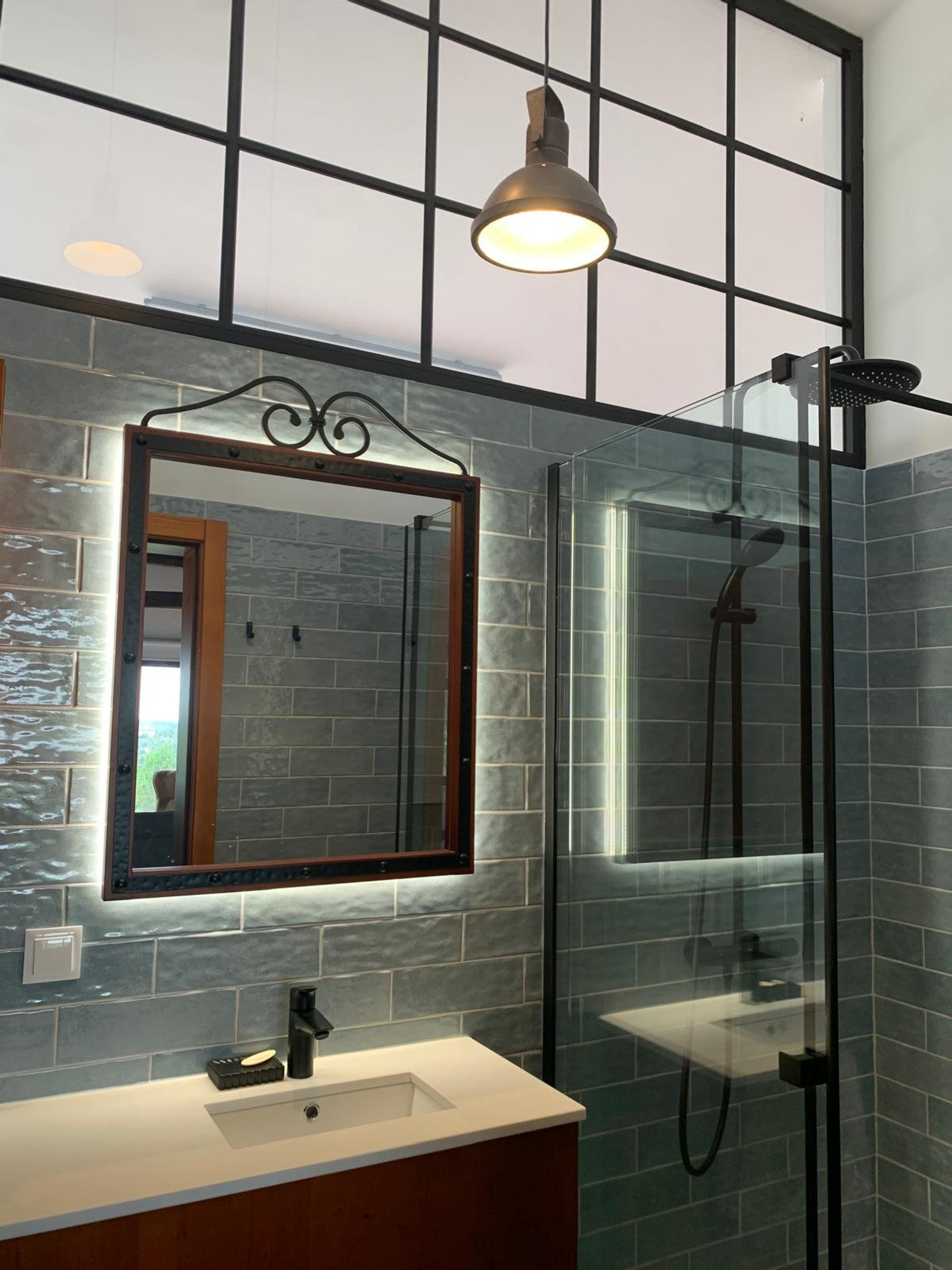 Stylish bathroom with mirror and shower