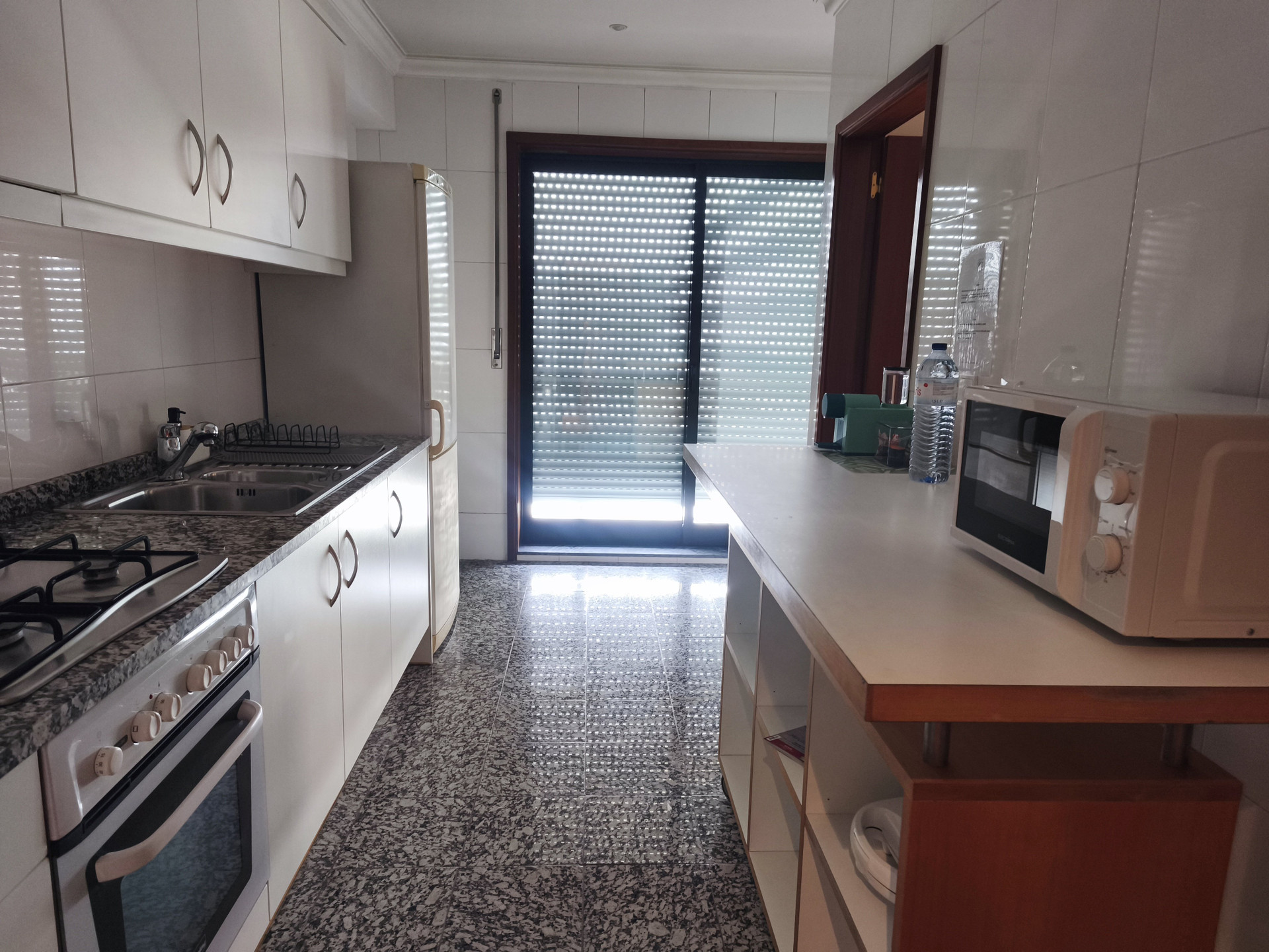 Full kitchen with oven and sink