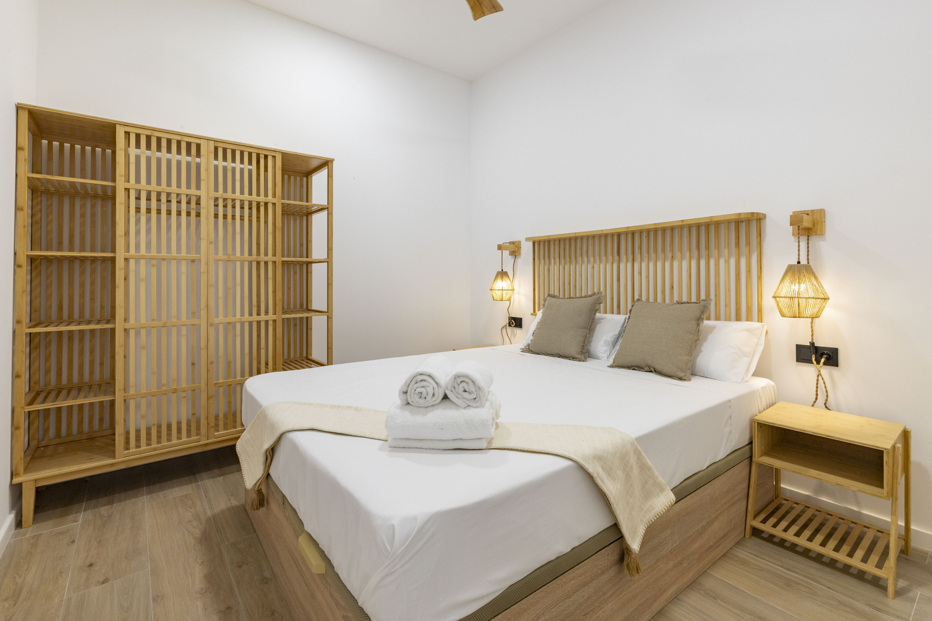 Bright bedroom with wooden headboard