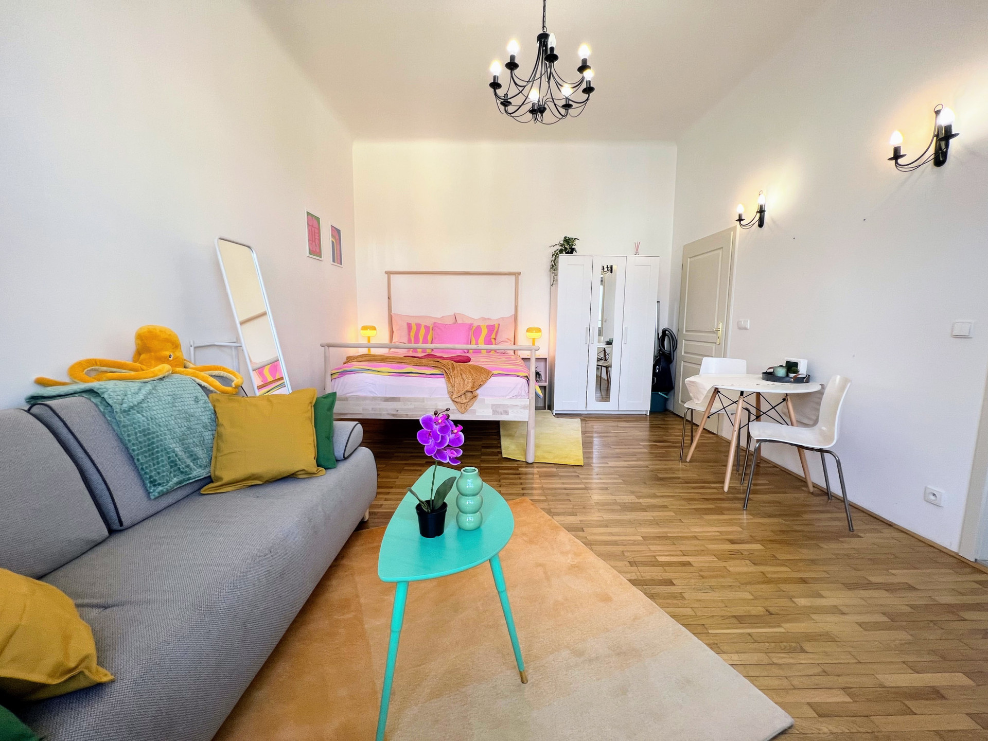 Bright studio with sofa and bed
