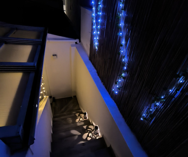 Rooftop staircase with fairy lights