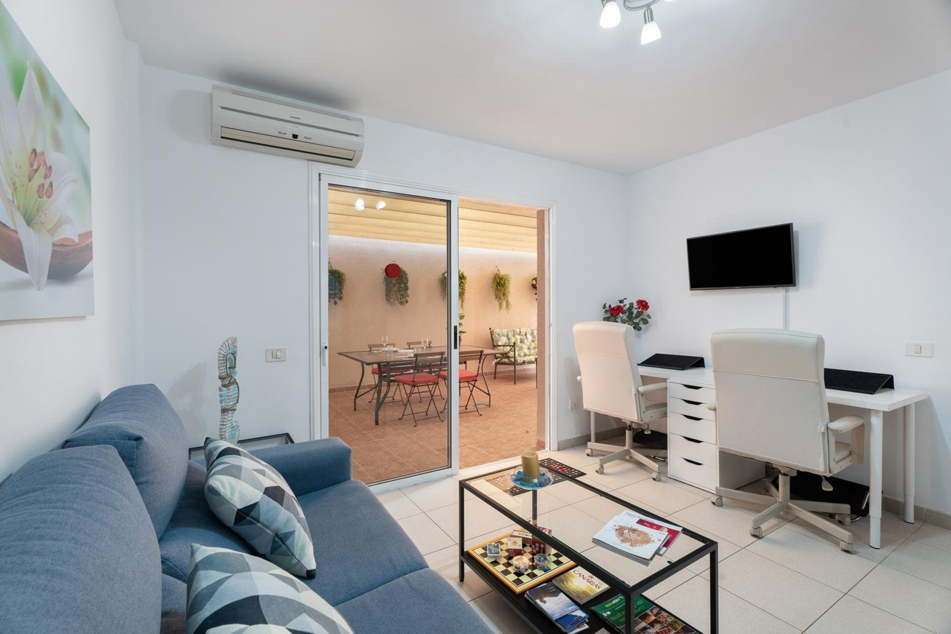 Living room with sofa and desk area