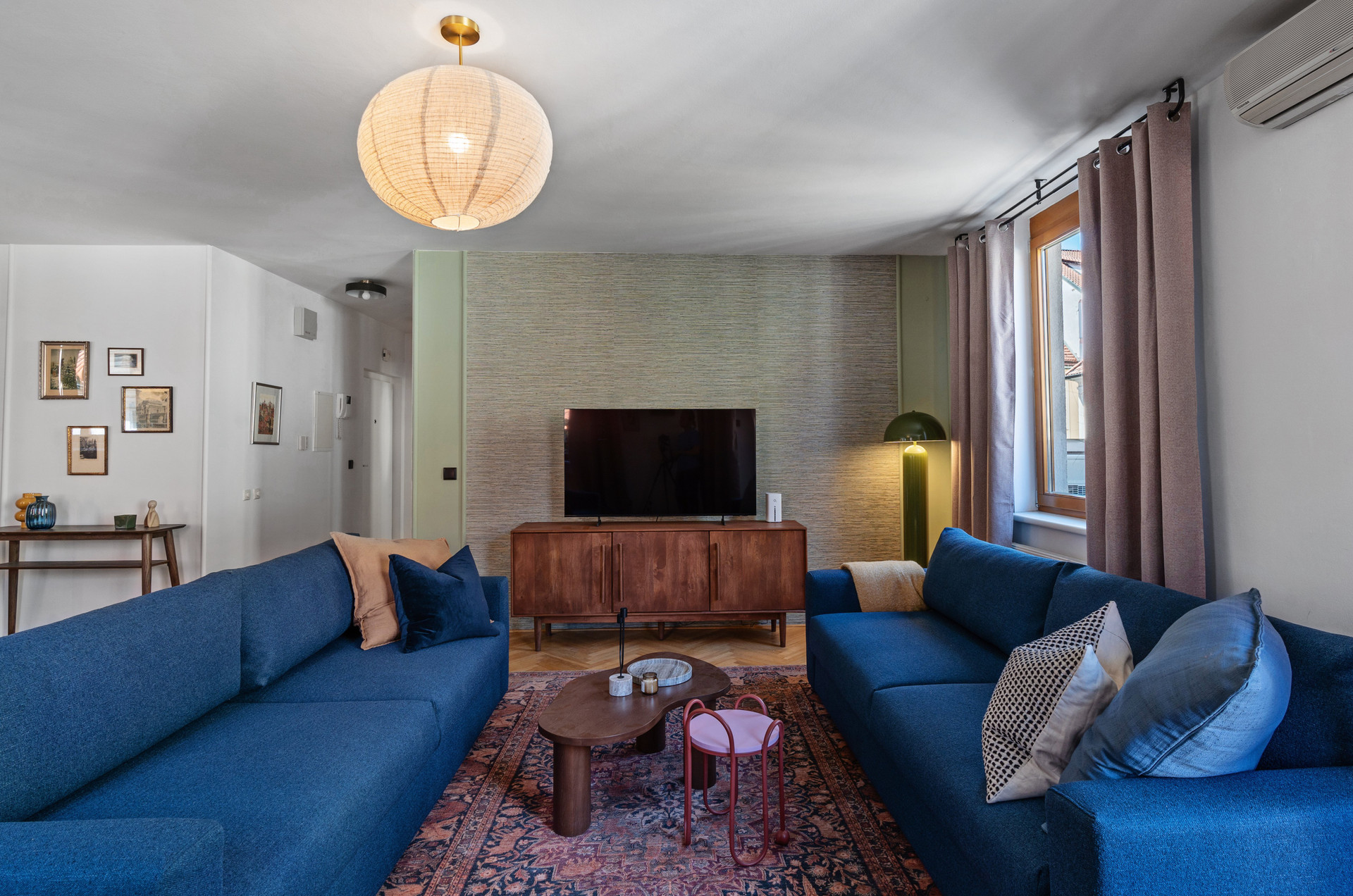 Living room two blue sofas TV