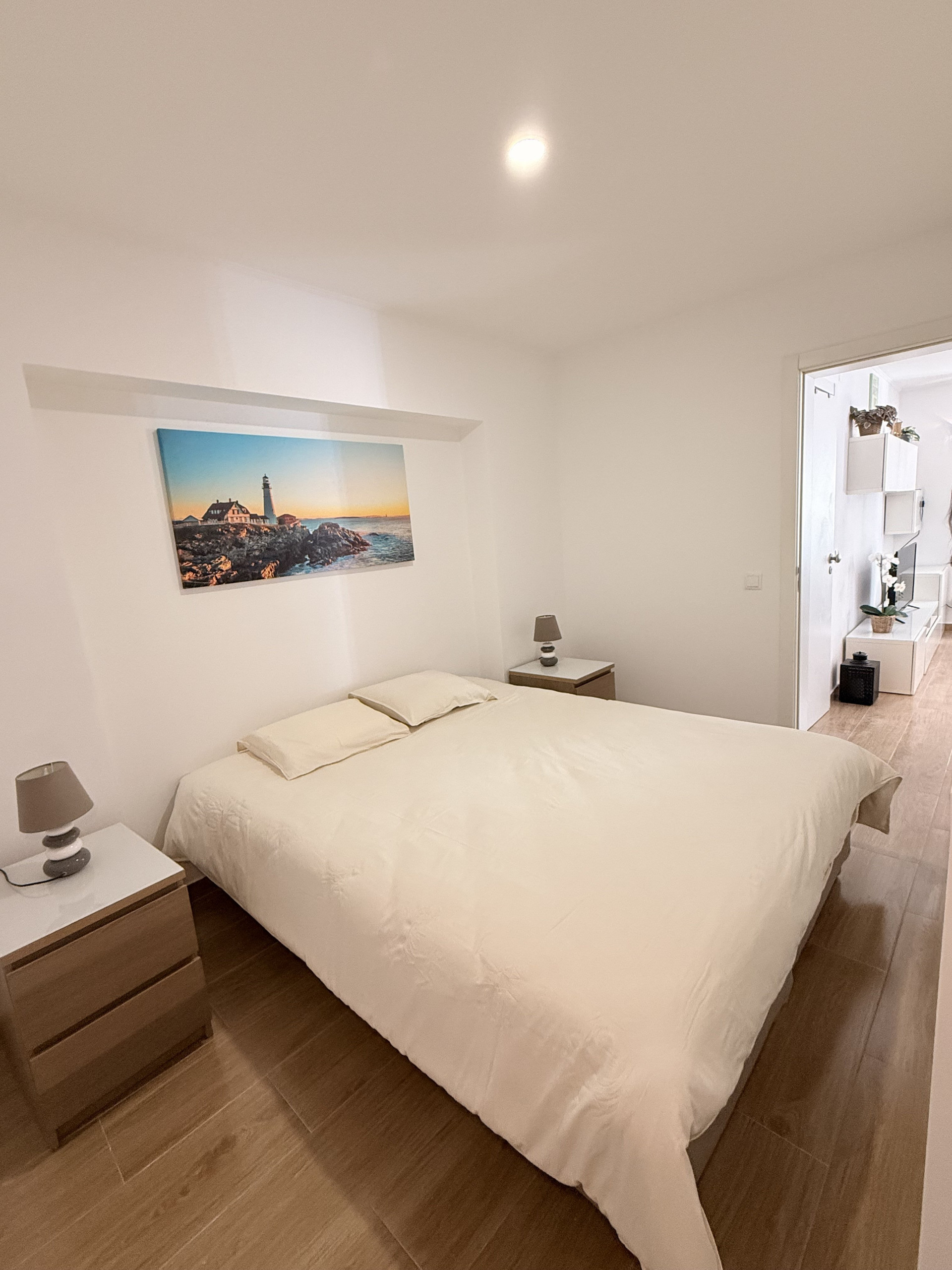 Bright bedroom with wooden headboard