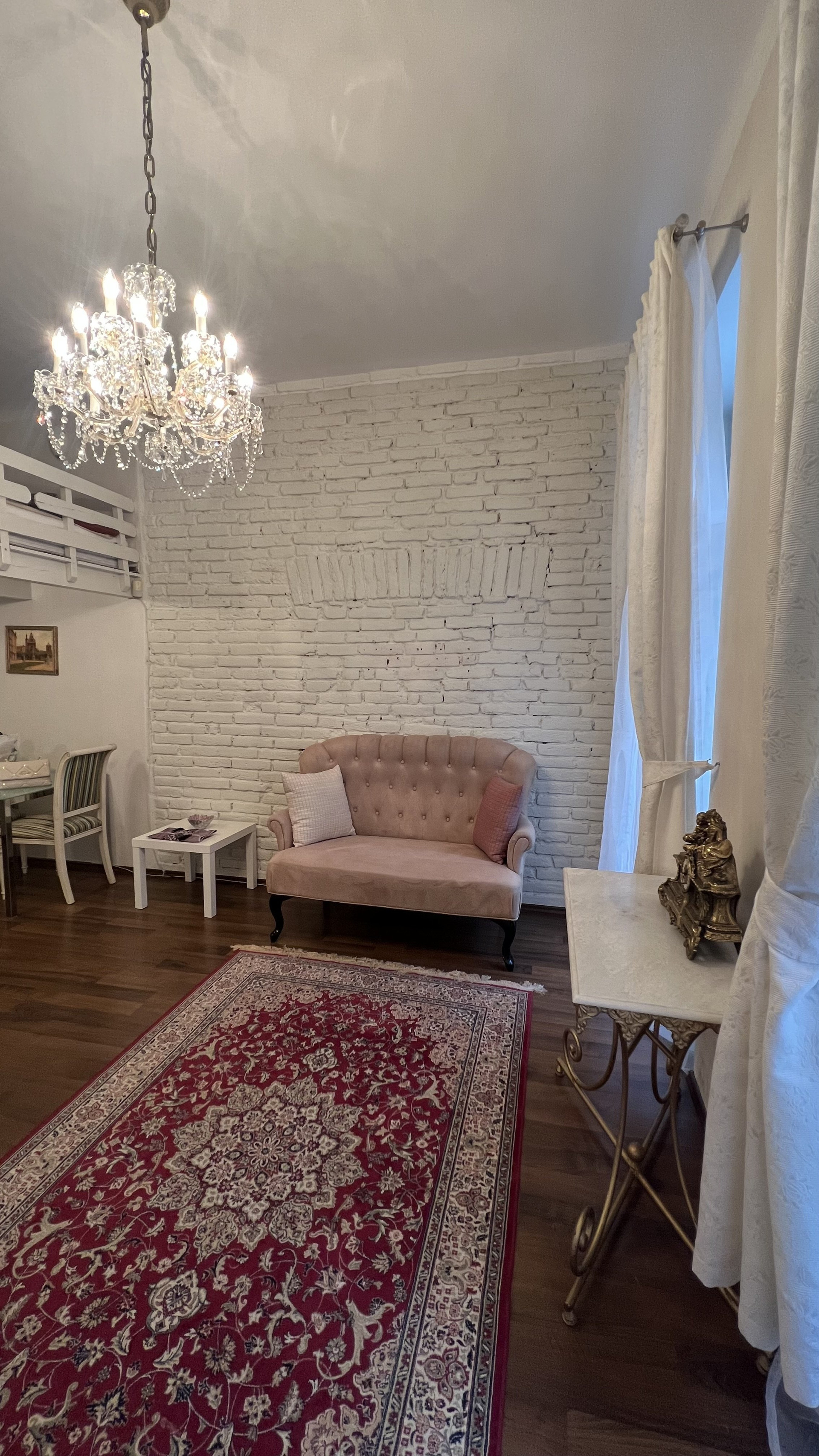 Living room sofa chandelier brick wall