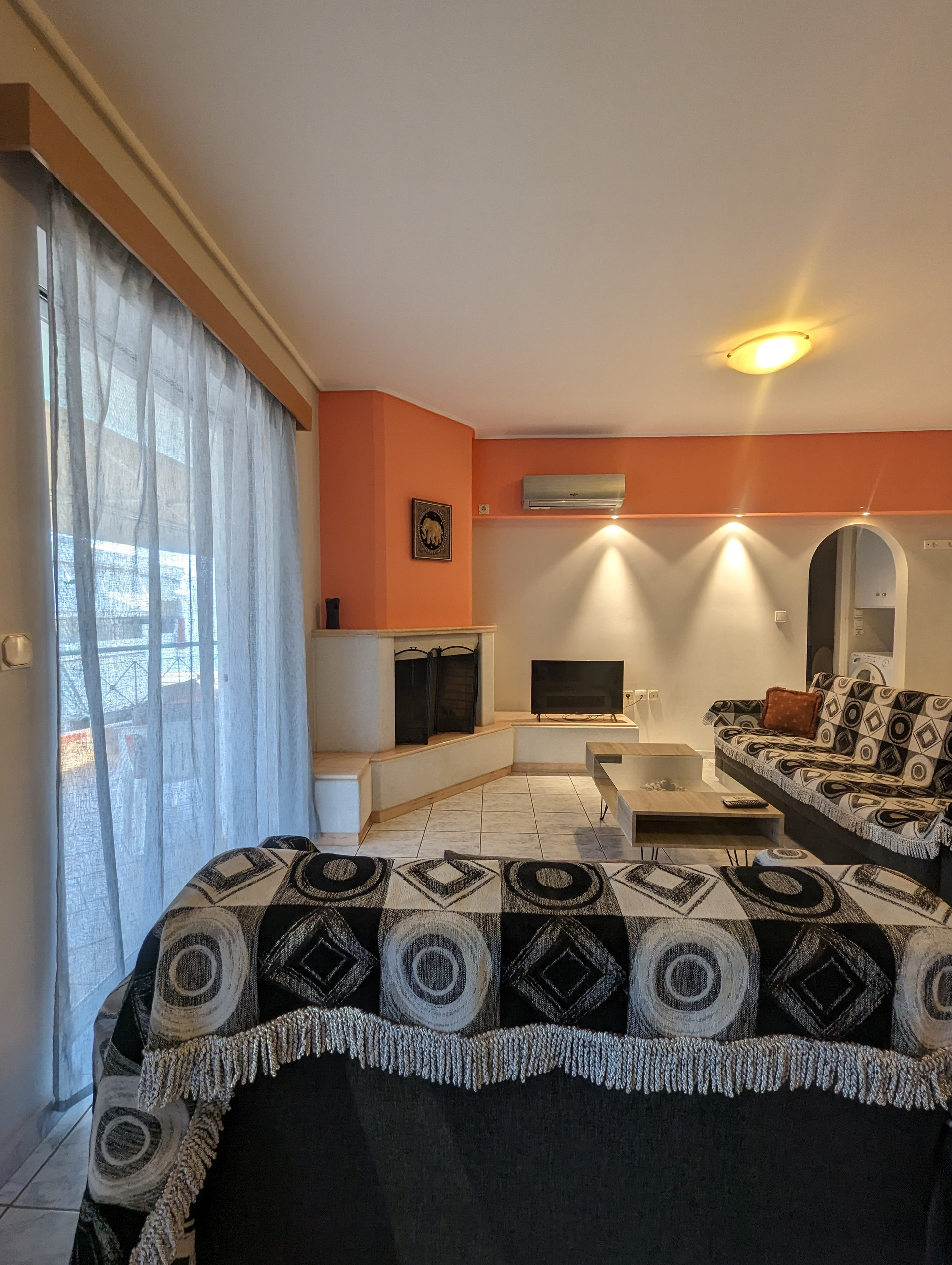 Living room with fireplace and sofa