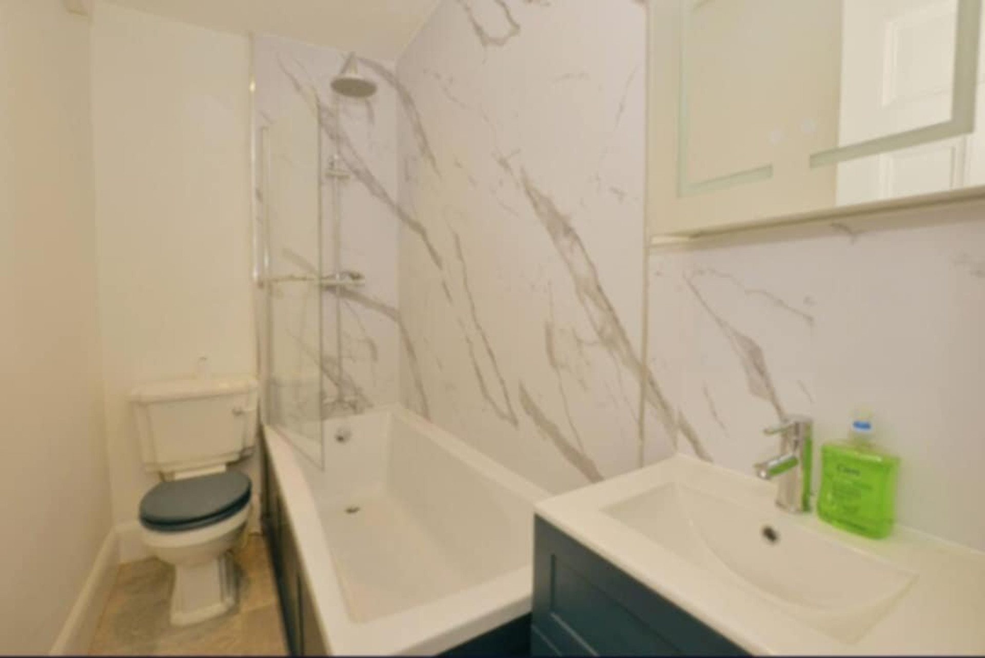 Marble bathroom with bath and shower