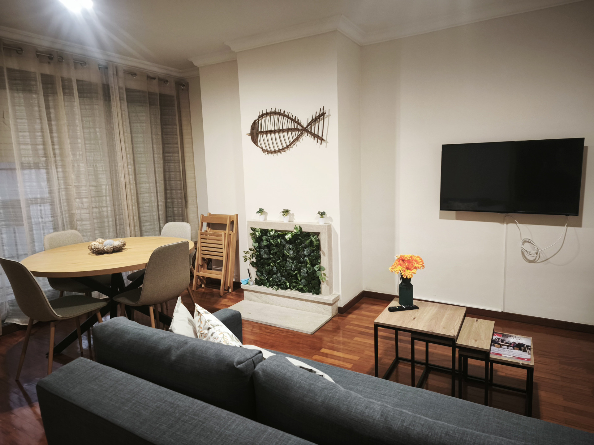 Bright living room with sofa and TV