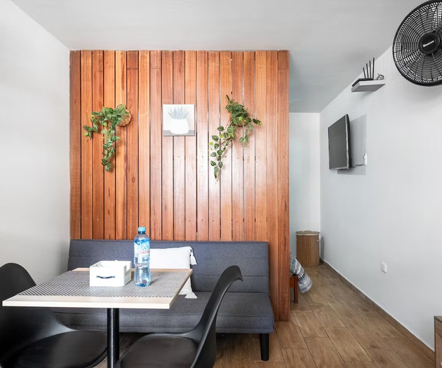 Dining nook with sofa and TV