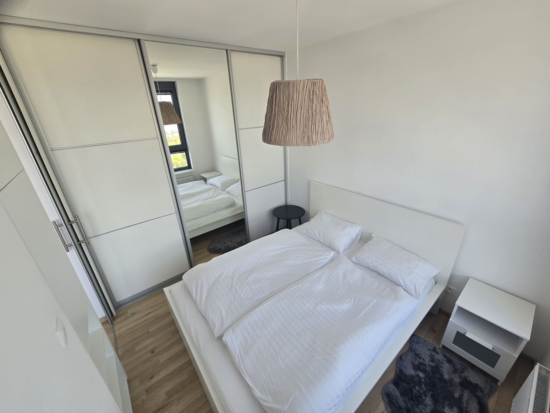 Bedroom with wardrobe and mirror