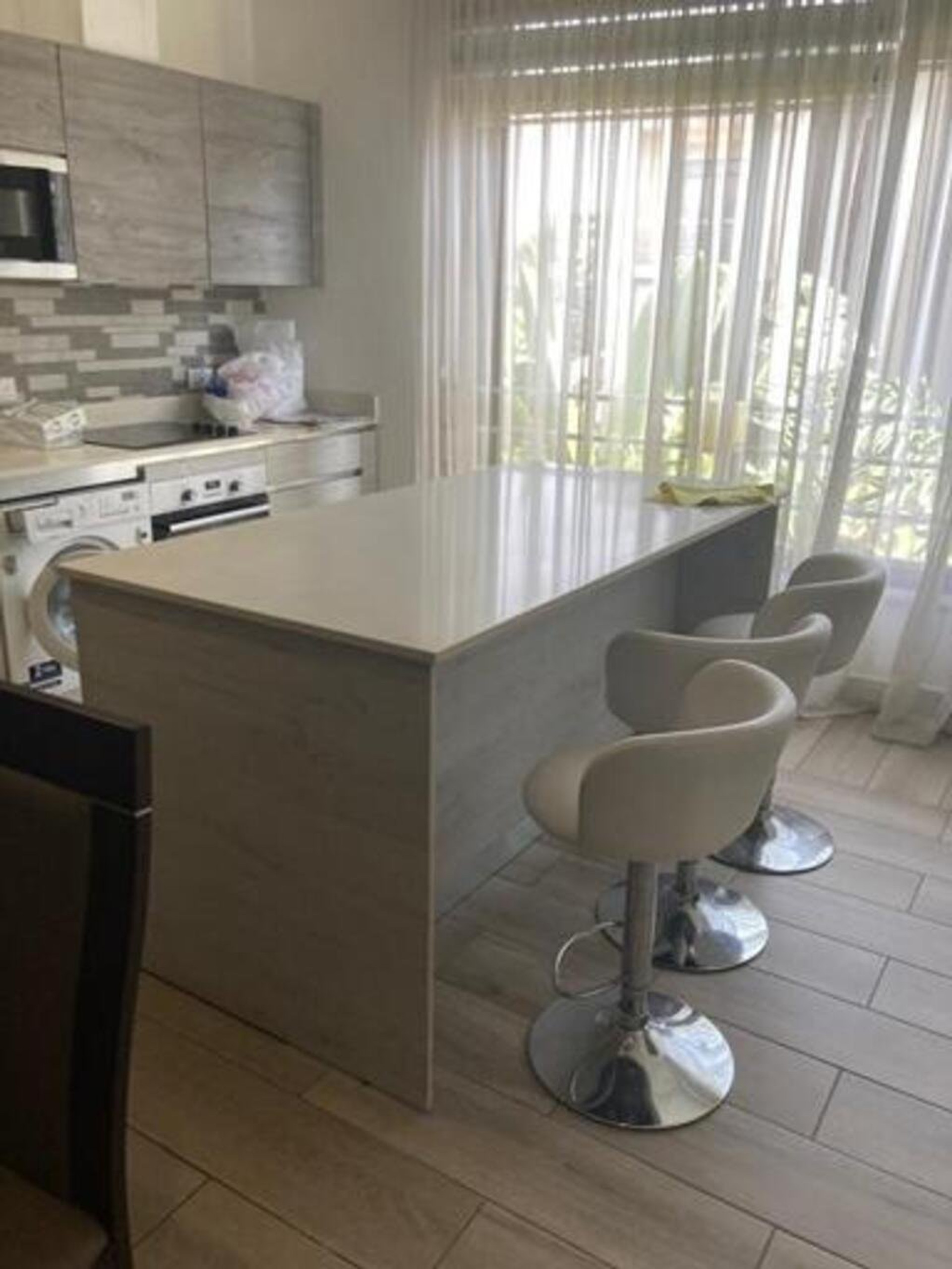 Kitchen Area The kitchen is fully equipped with modern appliances, quality fittings, and ample storage cabinets. It is designed for convenience, making cooking easy and enjoyable for daily living.