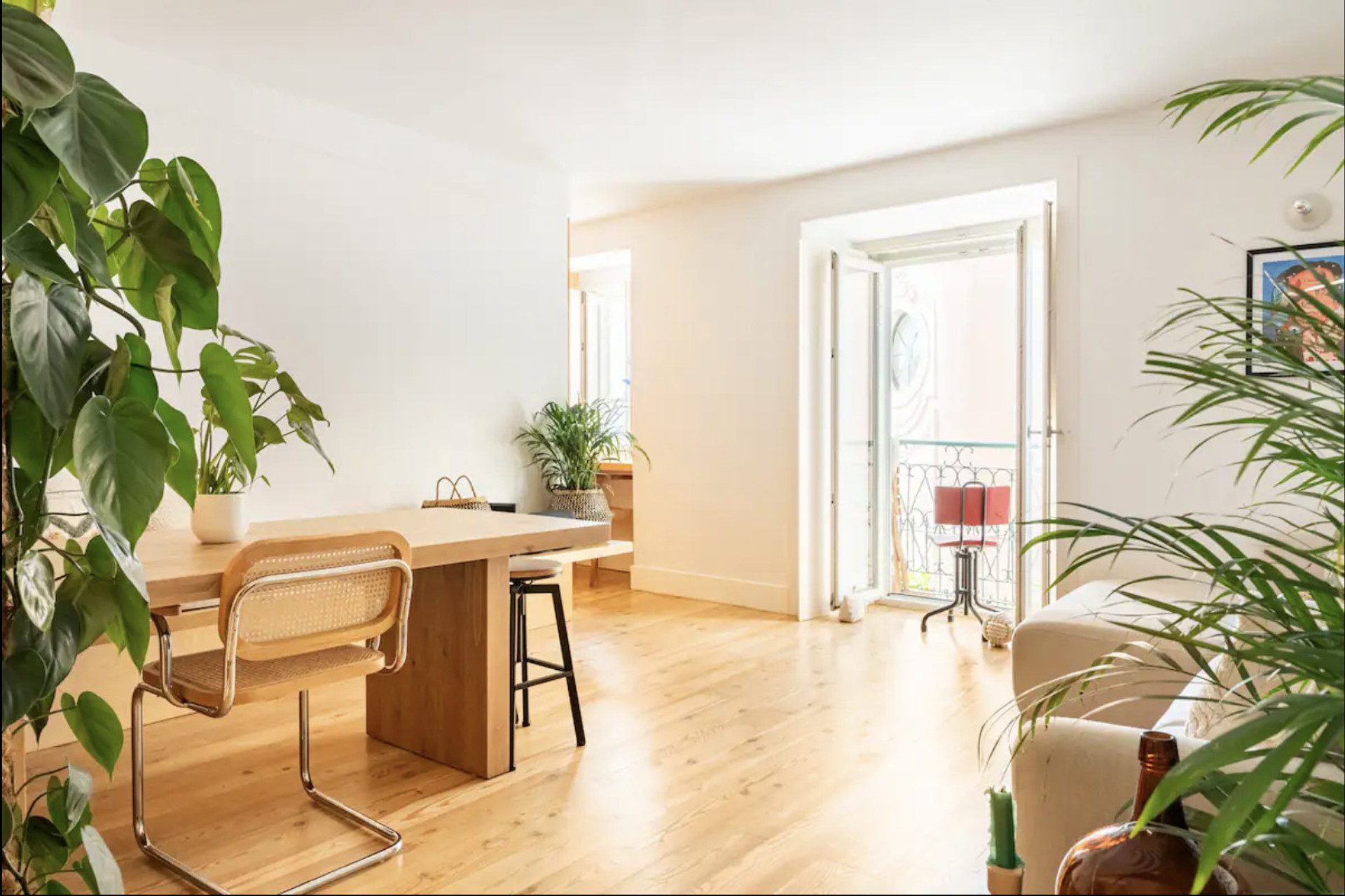 Living/dining room area with river view + desk area