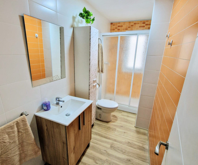 Bathroom with shower and sink