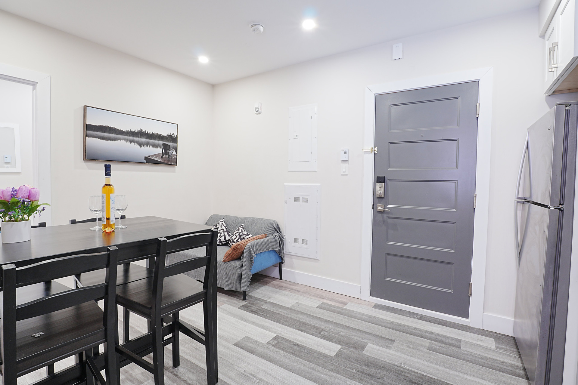 Entryway with dining table and sofa