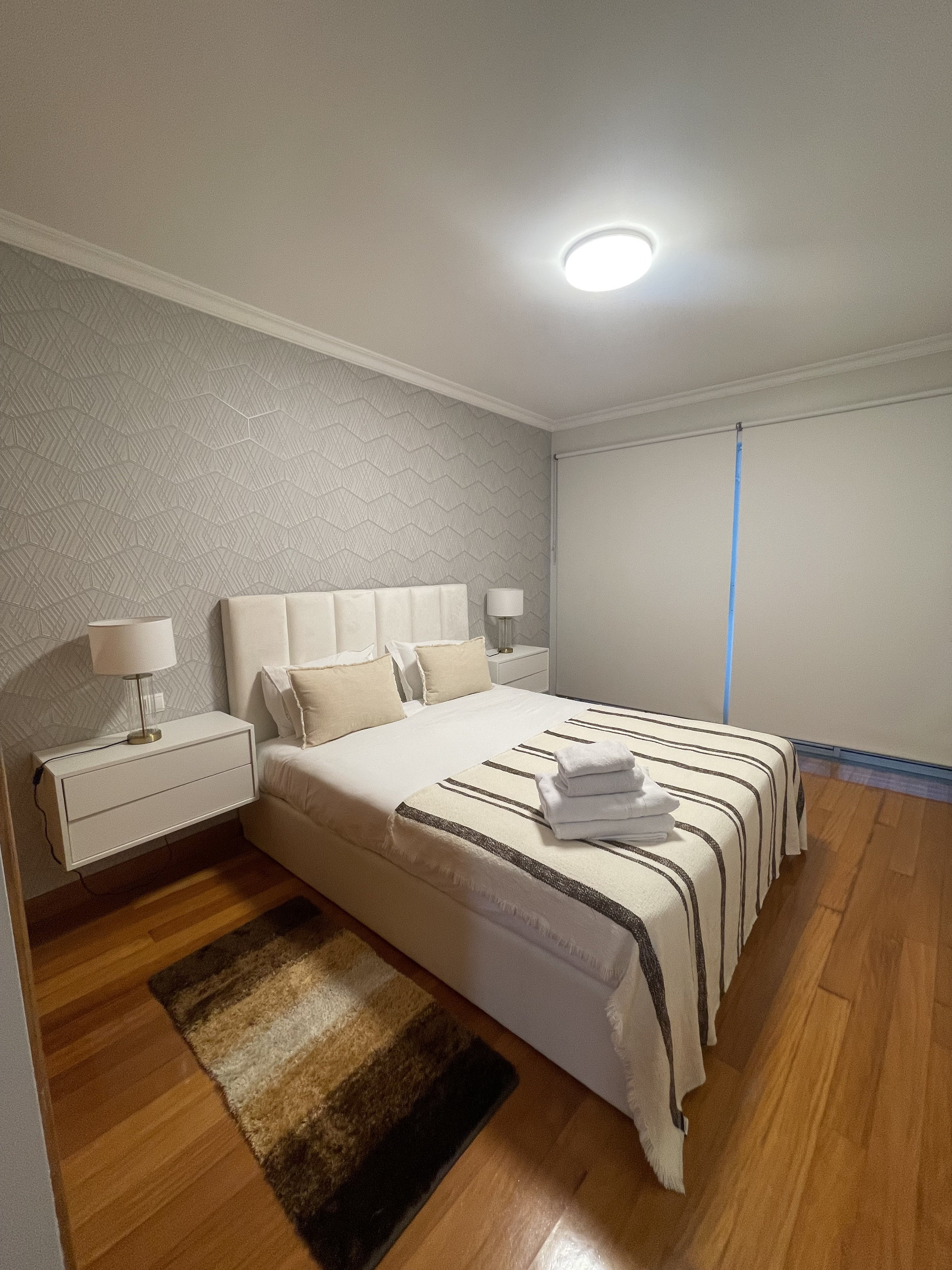 Master bedroom with wood floors
