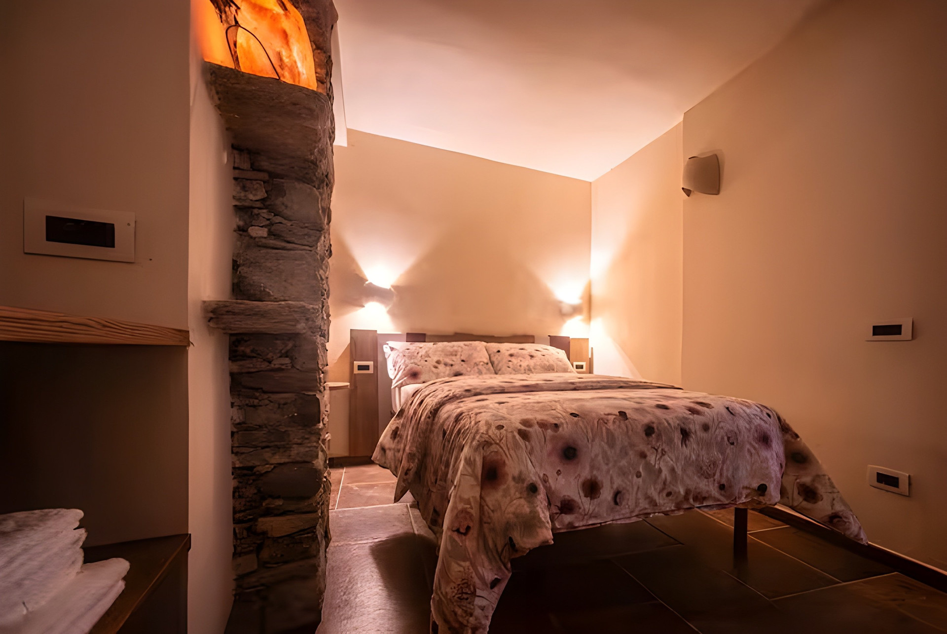 Cozy bedroom with stone accent