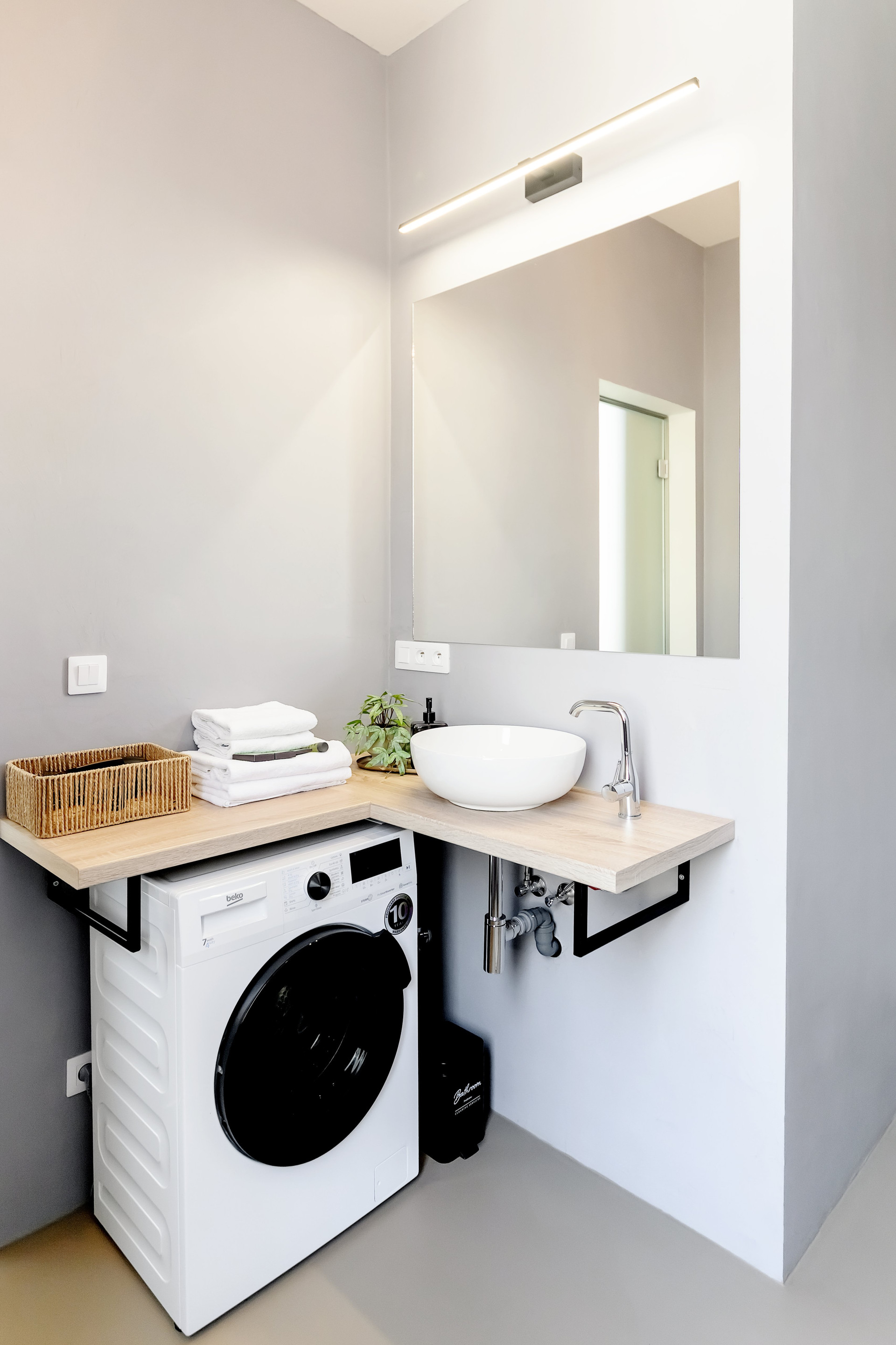 Bathroom with sink and washing machine