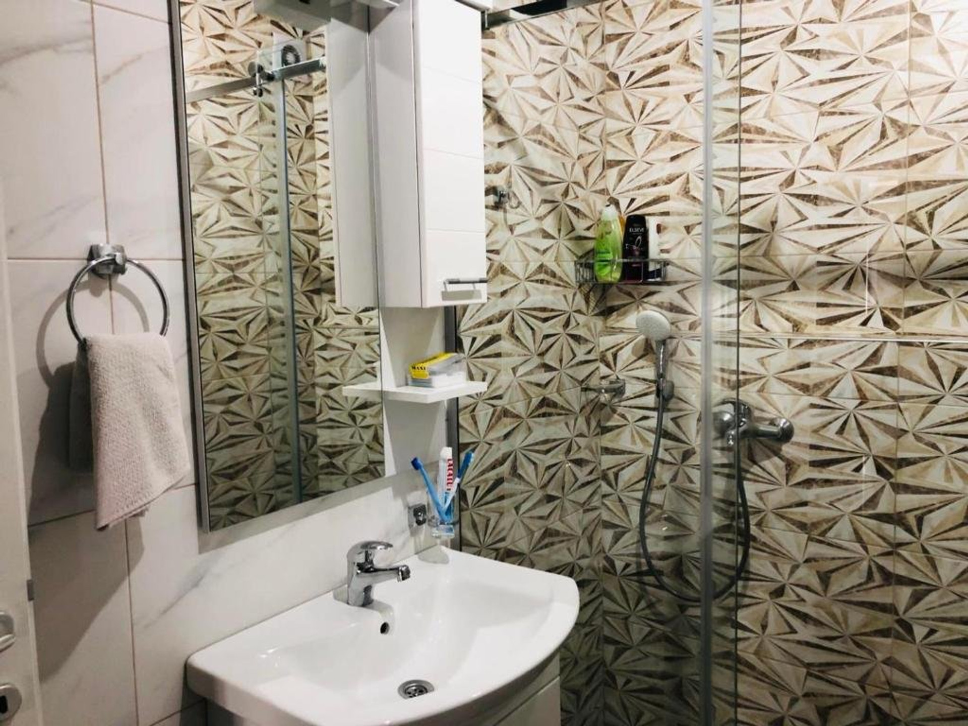 Bathroom with sink and shower