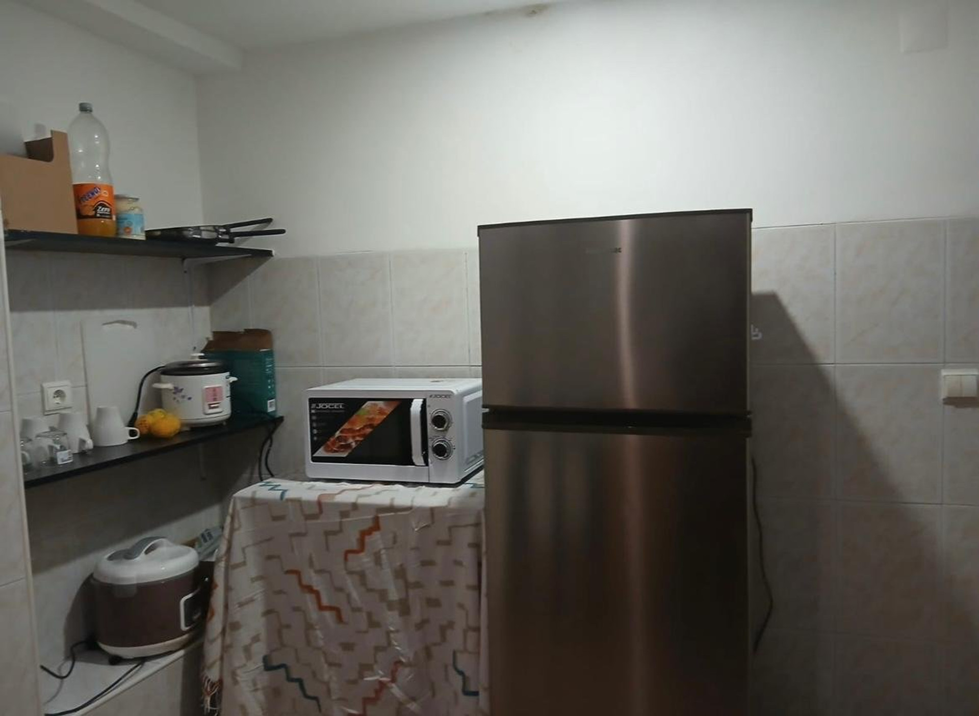 Kitchen with fridge and microwave