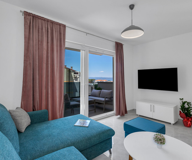 Living room with teal sofa