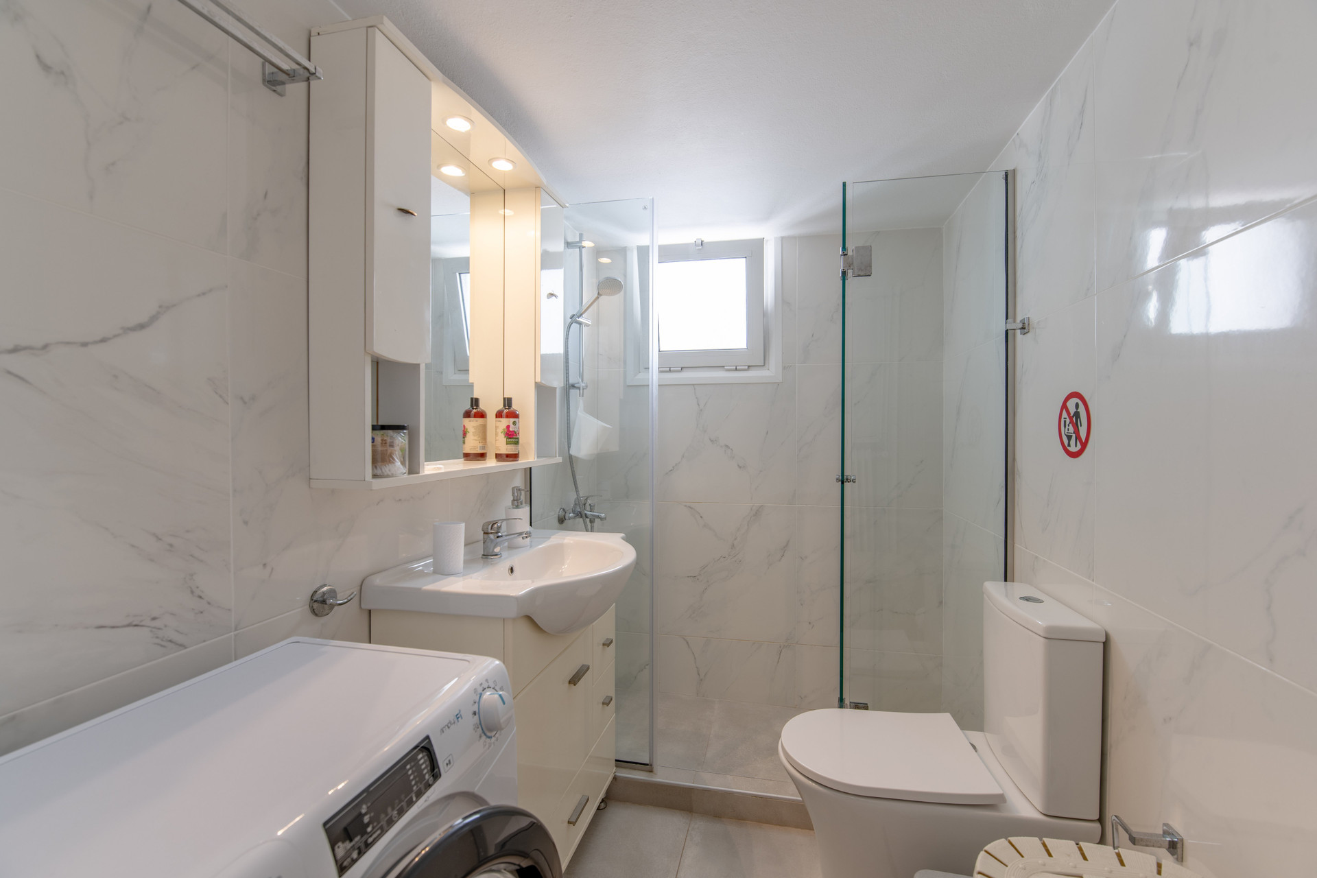 Bright bathroom with glass shower