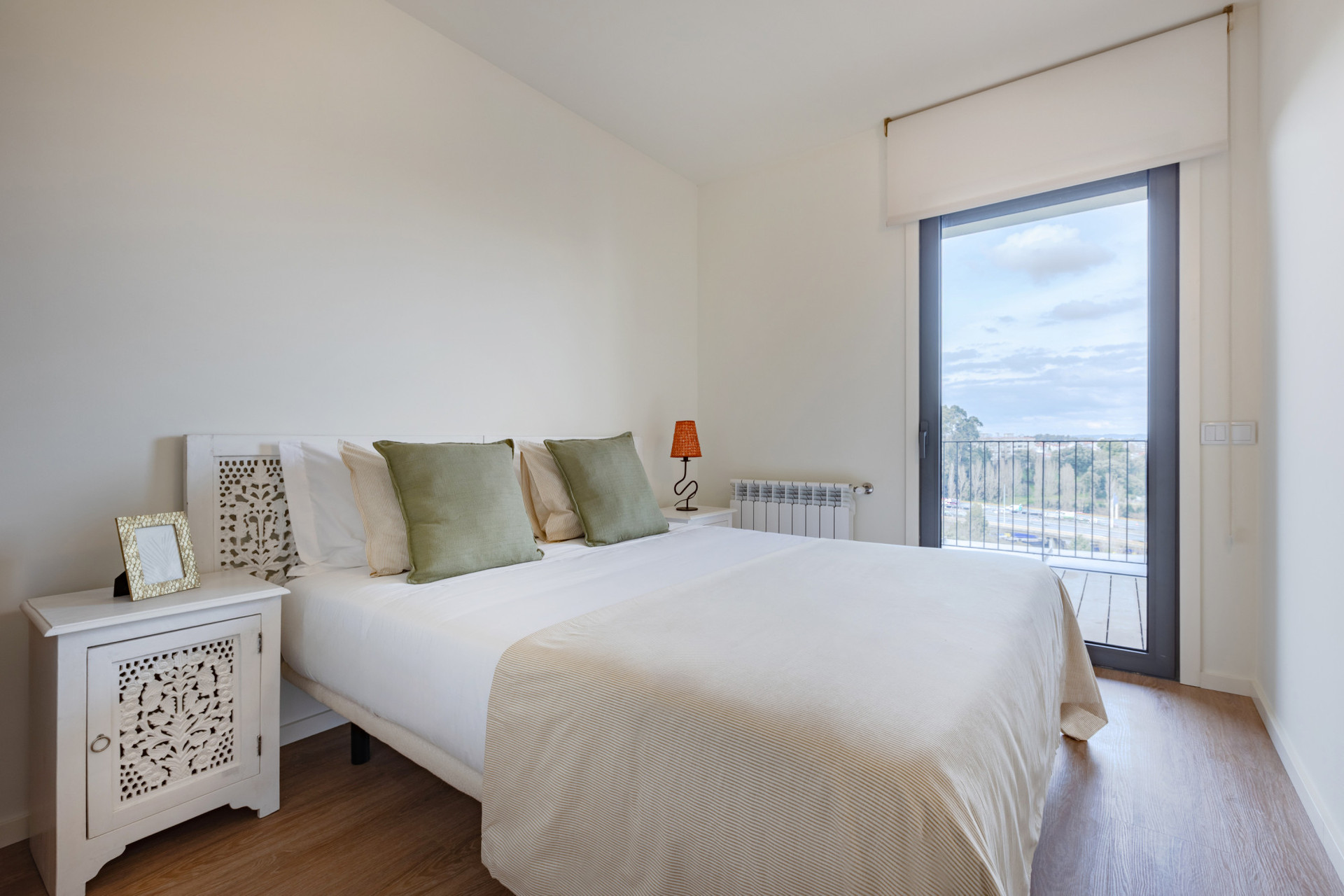 Bedroom with Double Bed , Wardrobe and access to the Balcony