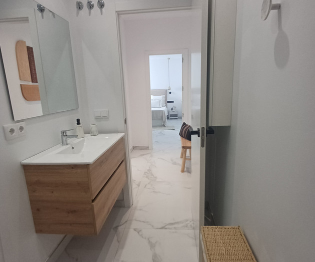 Bathroom sink and hallway view