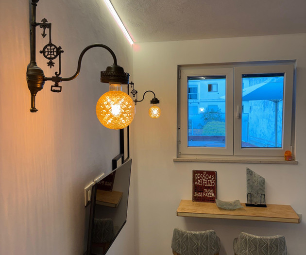 Living area with wall lamps