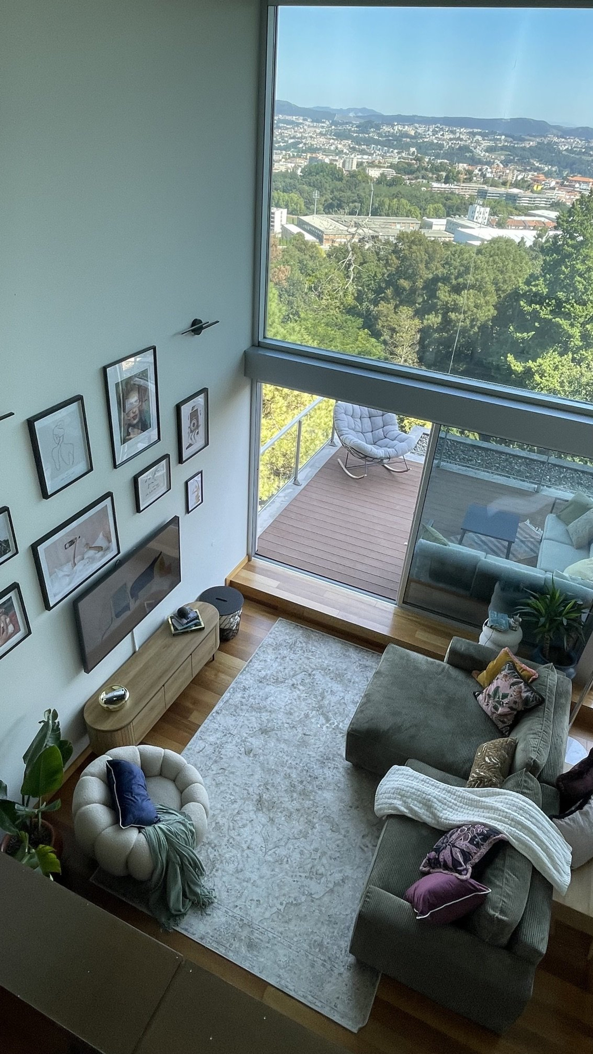 Double-height living room overlooking city
