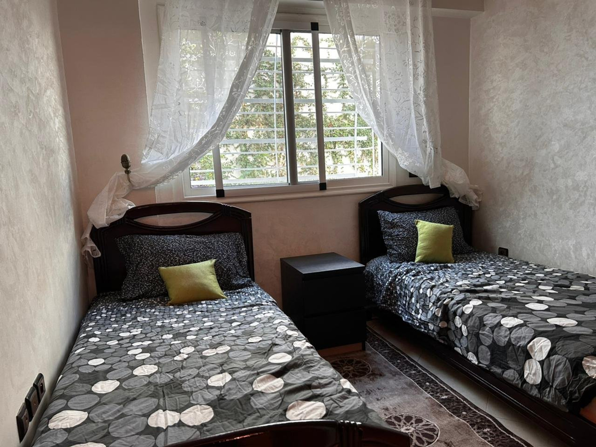 Twin bed bedroom with curtains