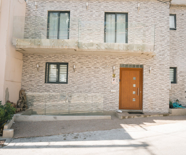 Facade with wooden front door