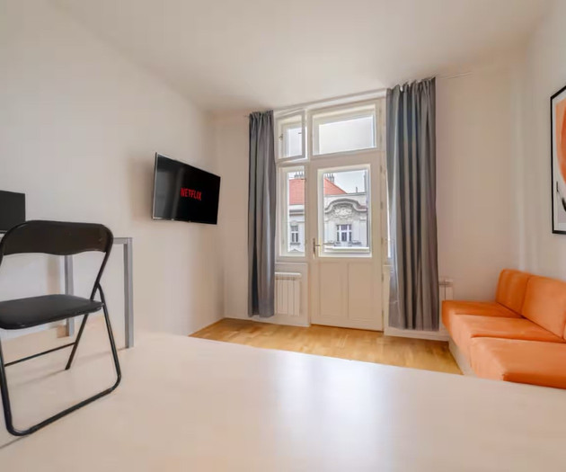 Chic Navy Studio with Balcony & Church View