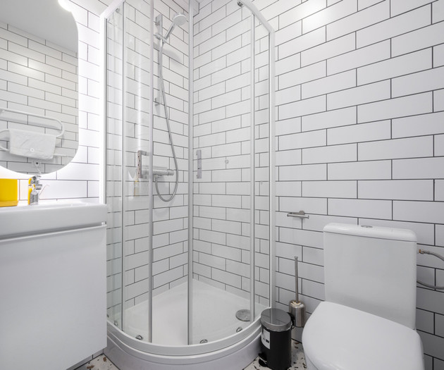Bathroom with shower, sink and toilet