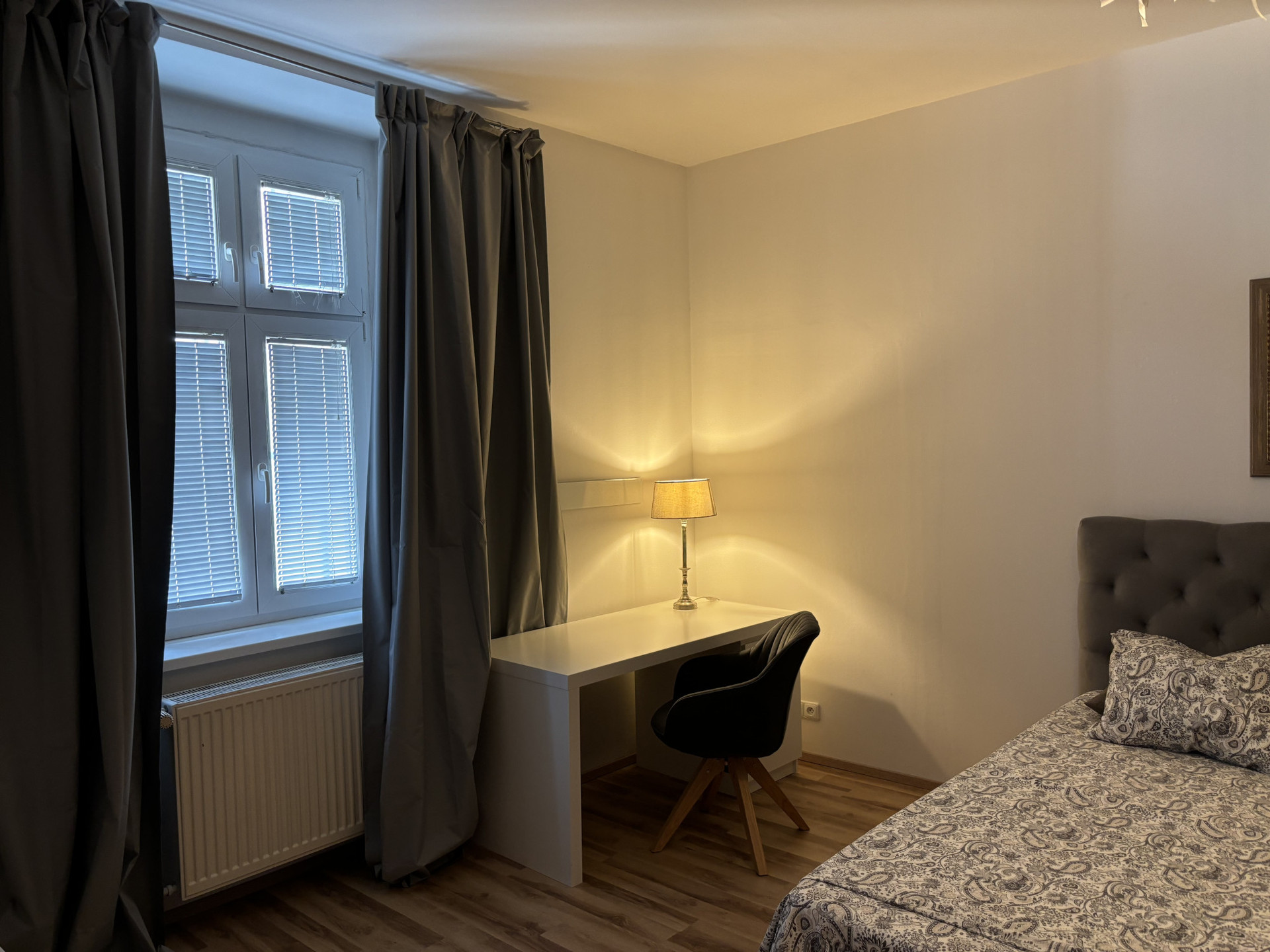 Bedroom 1: desk, window facing Laurinska street, black-out curtains
