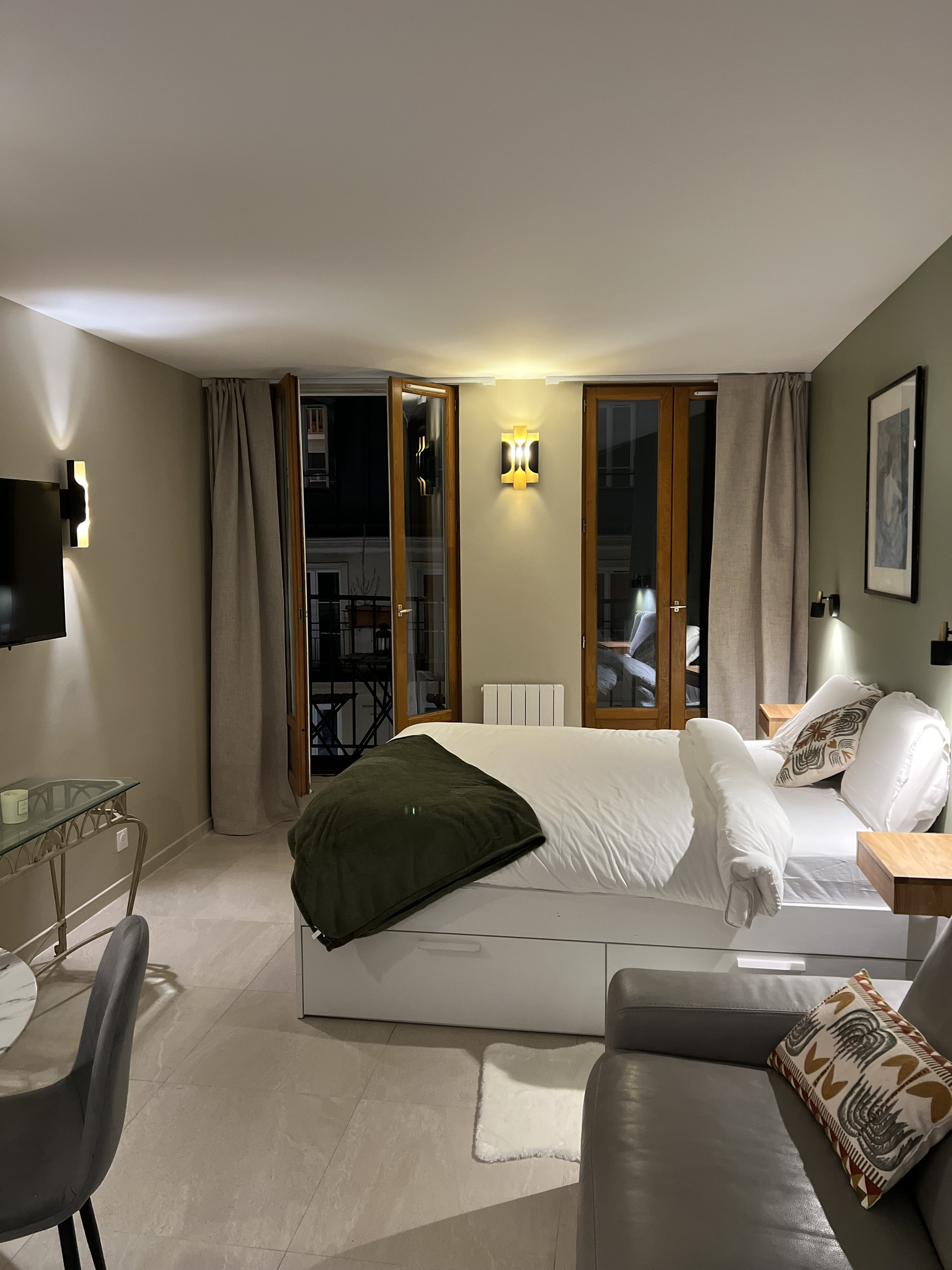 Bed with balcony doors open