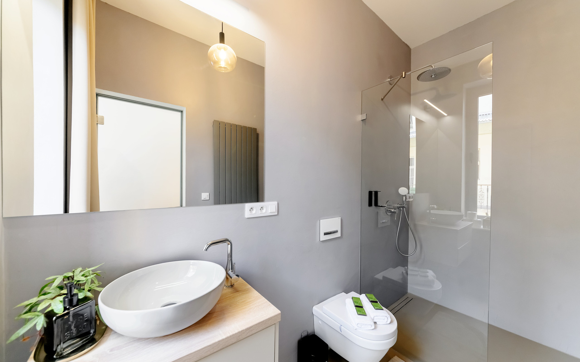 Bathroom with walk-in shower and mirror