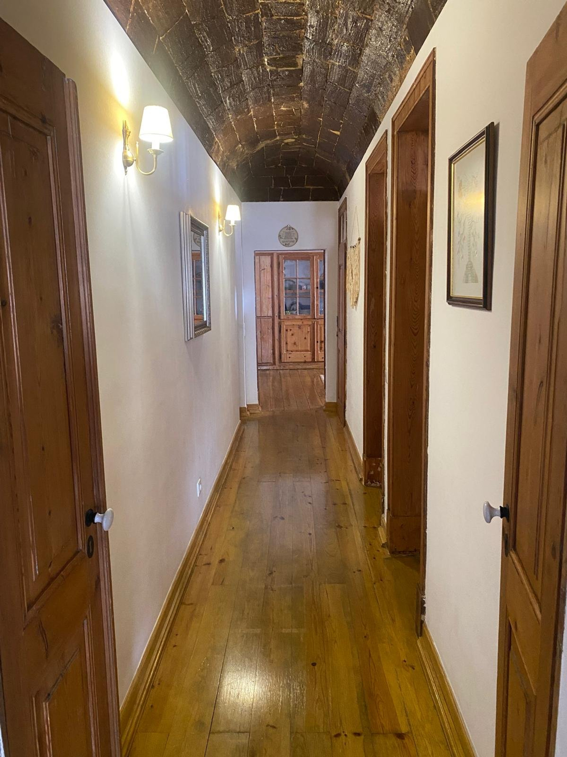 Long corridor with vaulted stone ceiling