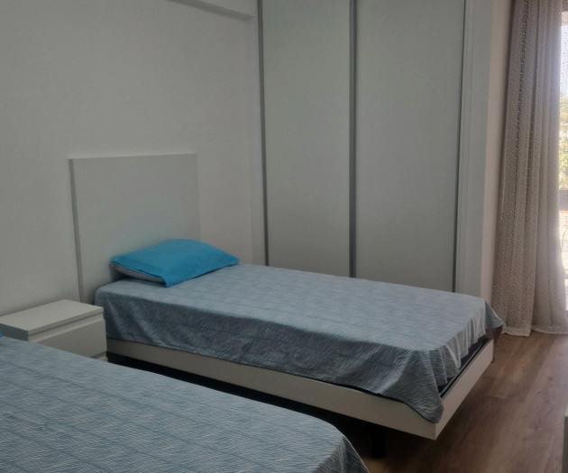Twin bedroom with balcony access