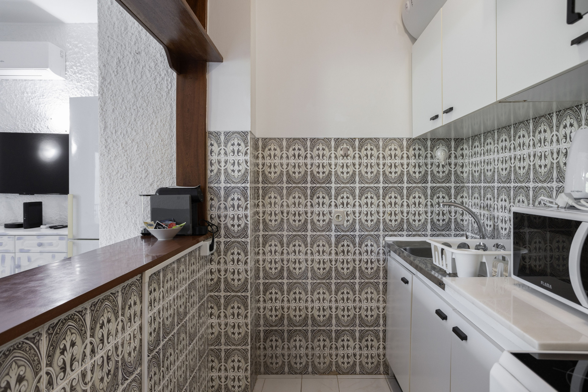 Kitchen with decorative patterned tiles