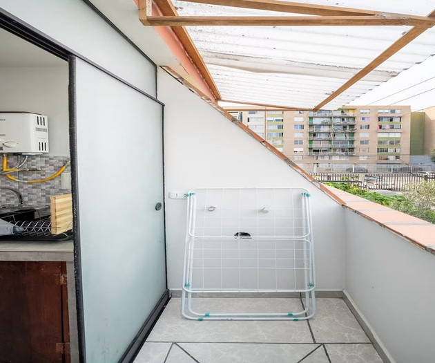 Balcony with laundry rack and view