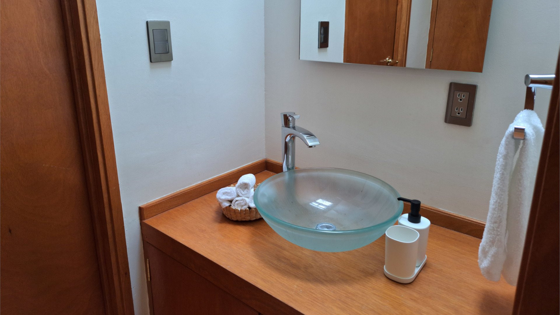 Bathroom vanity with glass bowl sink