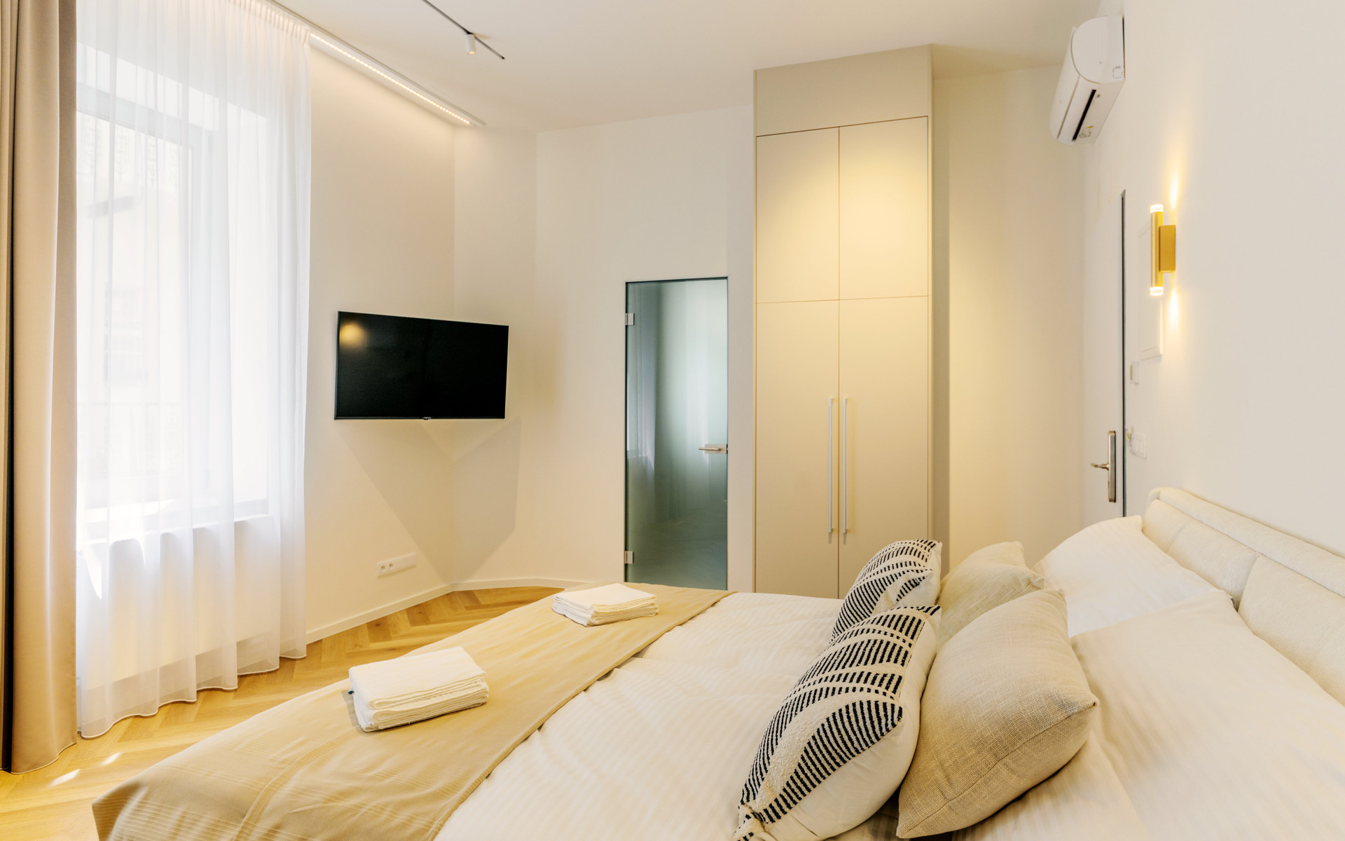 Bedroom with TV and wardrobe