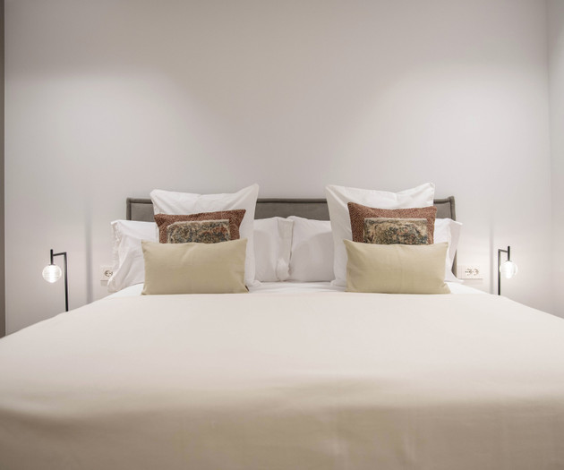 Bed with bedside lamps