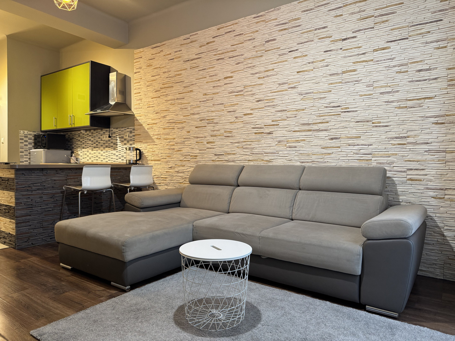 Living room with sofa and kitchen