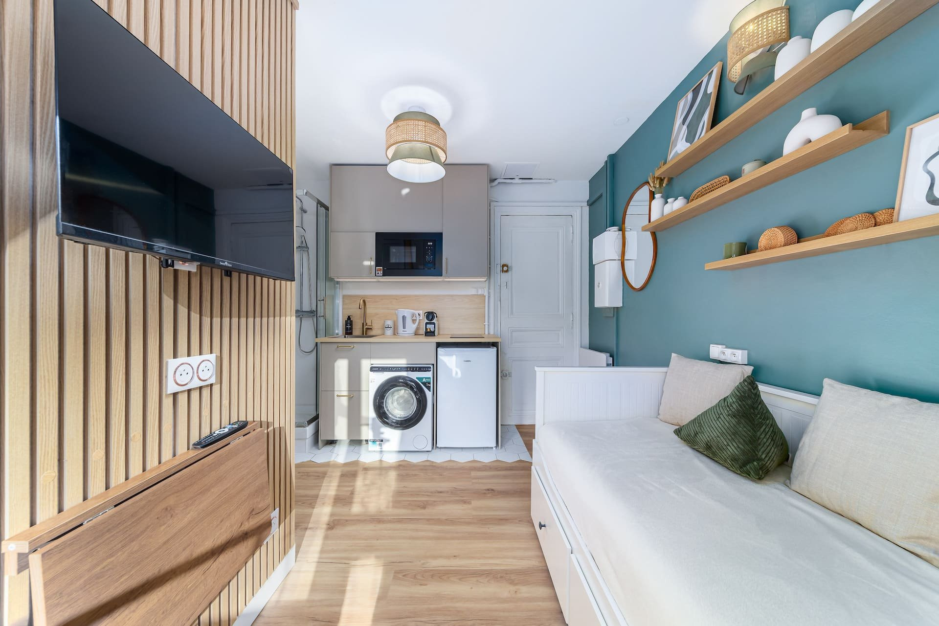 Living area with kitchenette and bed